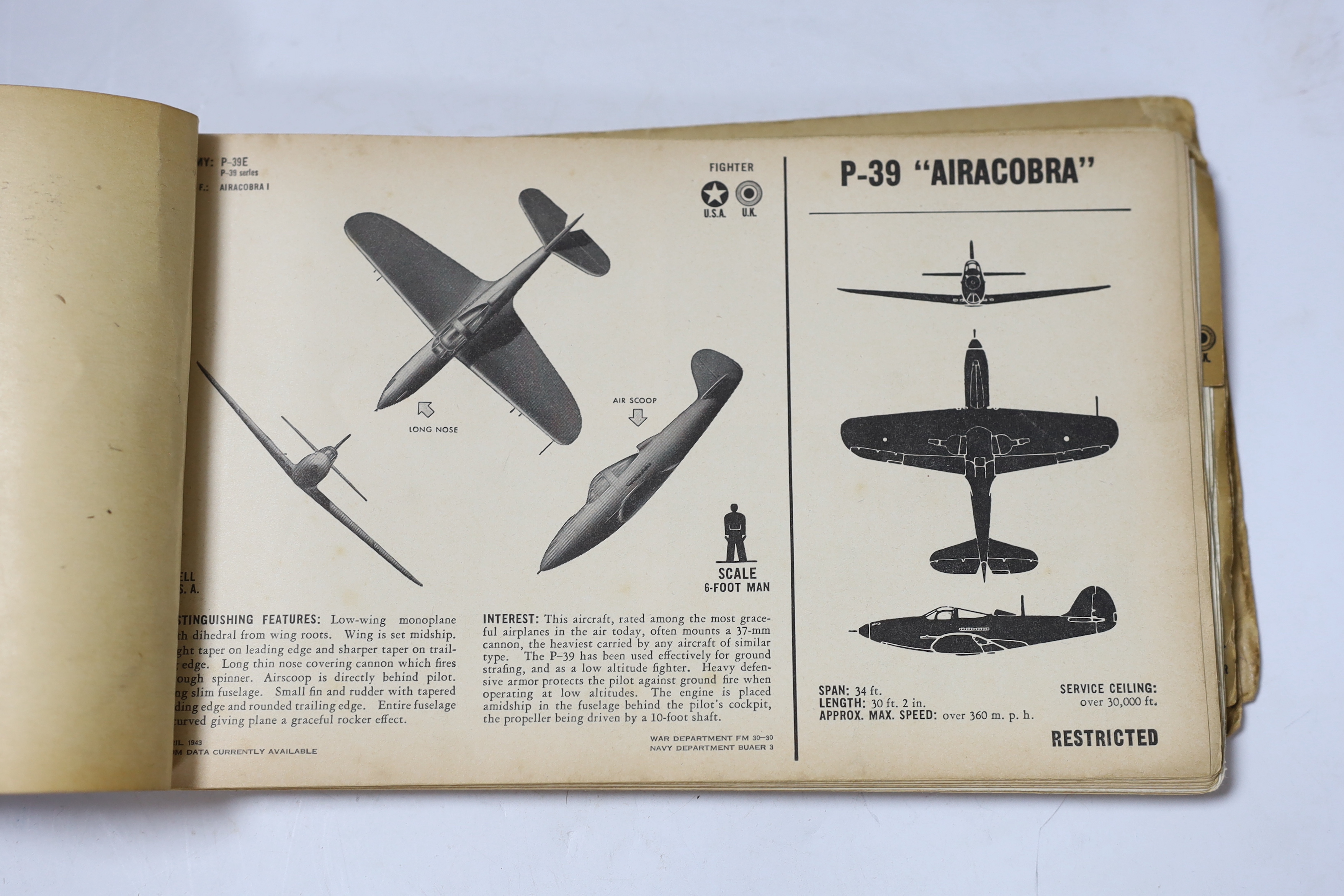 A WWII Air Ministry altimeter model XIV B and a War & Navy Department aircraft recognition pictorial manual